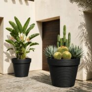 Black jumbo stone textured planters on a sunlit patio