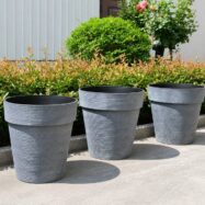 Blue Gray jumbo round planters in a landscaped garden