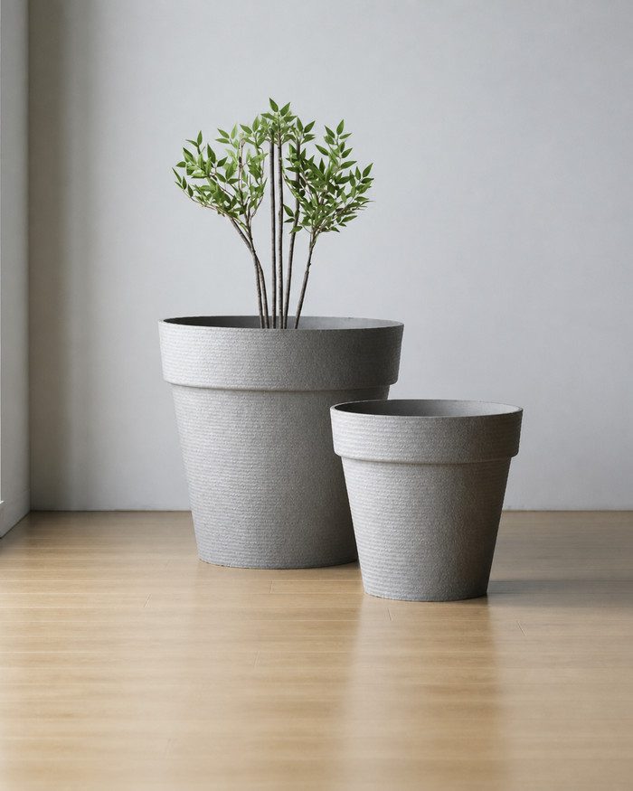 gallery-jumbo-light-gray-planters-studio Jumbo and Super Jumbo light gray raised-rim planters in a minimalist studio